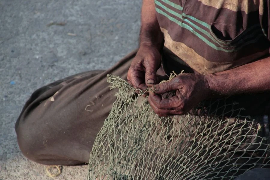 Traditional fishing net making.